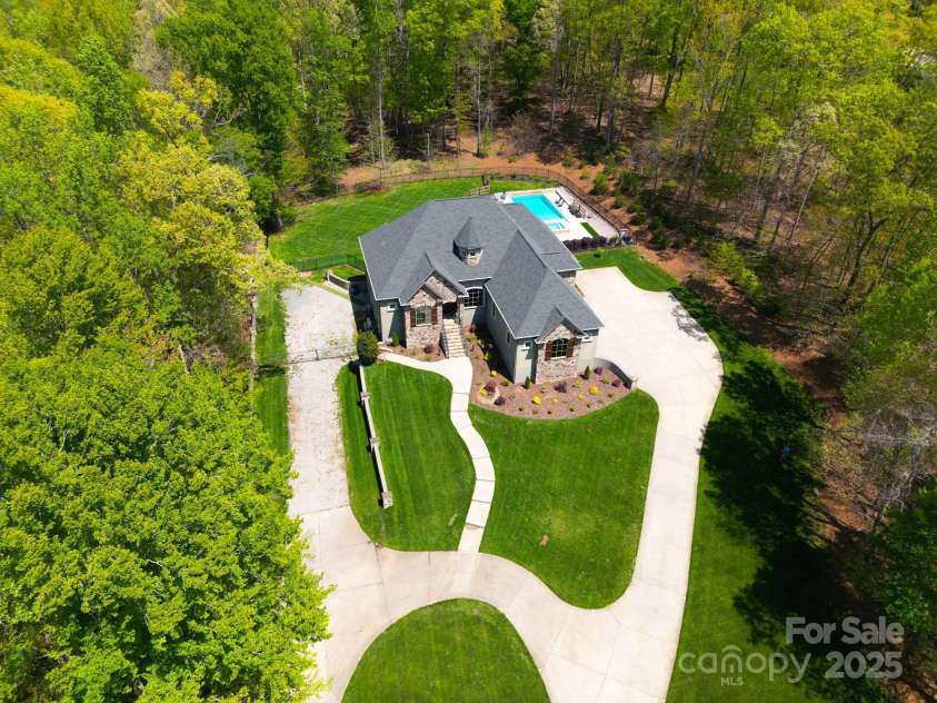 4071 King Wilkinson Road, Lincolnton, NC 28092.  MLS# CAR4241199, YatesRealty ID 20053. Beautiful large lot includes some wooded areas and borders a stream!