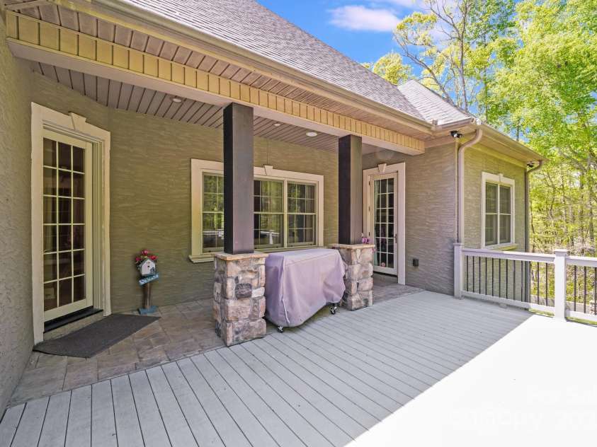 4071 King Wilkinson Road, Lincolnton, NC 28092.  MLS# CAR4241199, YatesRealty ID 20053. Door on left brings you into the kitchen/dining area, door on right brings you into the primary bedroom.