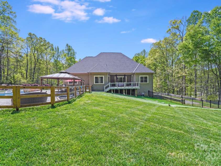 4071 King Wilkinson Road, Lincolnton, NC 28092.  MLS# CAR4241199, YatesRealty ID 20053. Fenced yard separated from fenced pool area