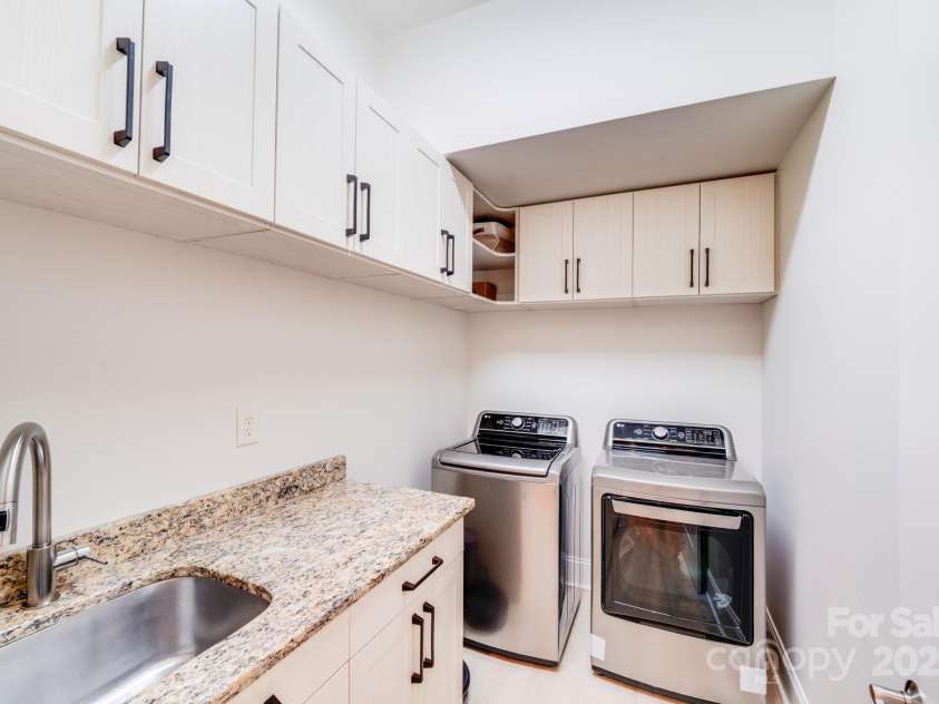 4071 King Wilkinson Road, Lincolnton, NC 28092.  MLS# CAR4241199, YatesRealty ID 20053. Laundry room with upgraded cabinets