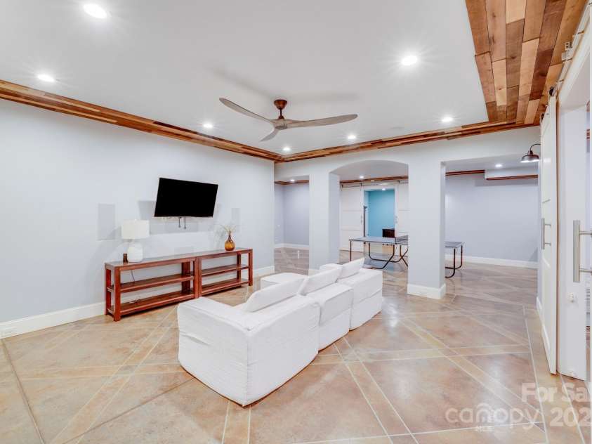 4071 King Wilkinson Road, Lincolnton, NC 28092.  MLS# CAR4241199, YatesRealty ID 20053. One of several basement entertainment areas.