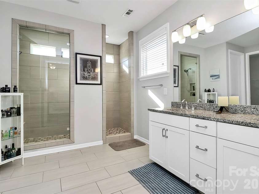 2225 Prairie Road, Concord, NC 28027.  MLS# CAR4337375, YatesRealty ID 20055. Pristine primary bathroom.  Dual vanity.  Expanded shower
