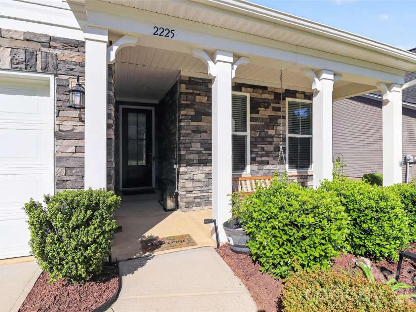 2225 Prairie Road, Concord, NC 28027.  MLS# CAR4337375, YatesRealty ID 20055. Relax on your front porch swing!