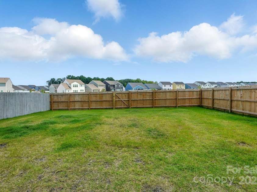 133 Aspire Circle, Wingate, NC 28174.  MLS# CAR4267048, YatesRealty ID 20057. Full privacy fence