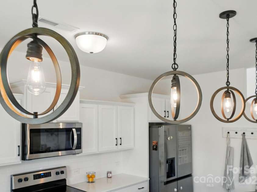 133 Aspire Circle, Wingate, NC 28174.  MLS# CAR4267048, YatesRealty ID 20057. Pendant lights are a great design