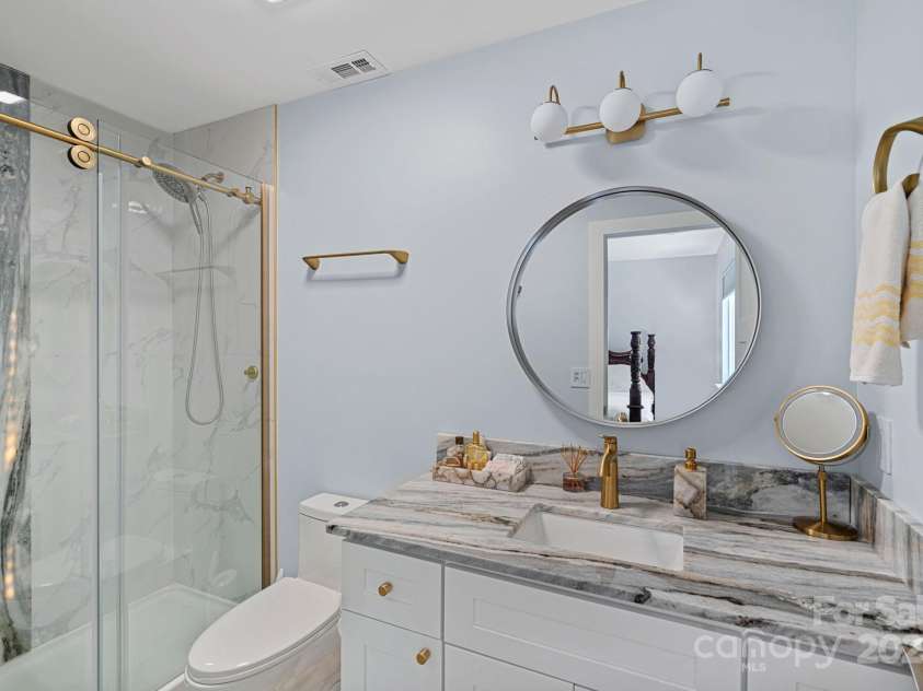 8122 Sherington Way, Charlotte, NC 28227.  MLS# CAR4239520, YatesRealty ID 20058. Primary bath with quartz shower