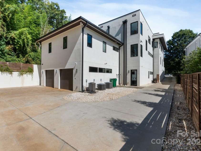 1516 Princeton Avenue, Charlotte, NC 28209.  MLS# CAR4303651, YatesRealty ID 2006. Attached 2 car garage view from back of house.