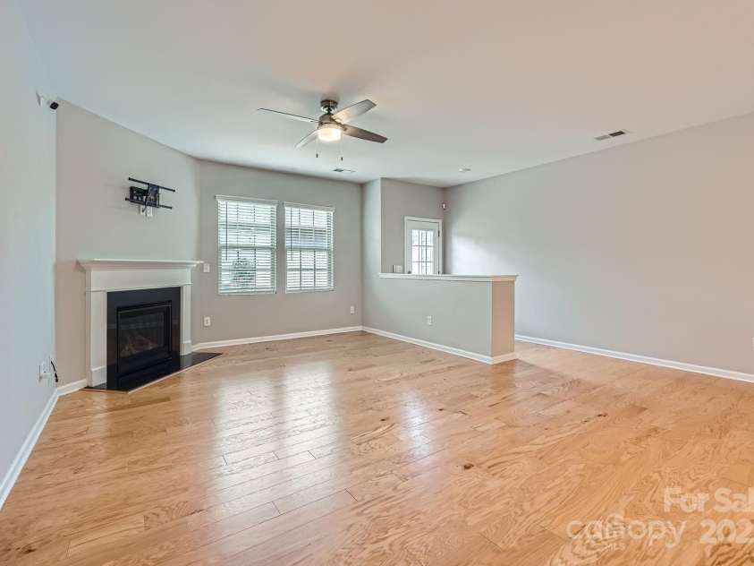 19812 Elise Caroline Alley, Davidson, NC 28036.  MLS# CAR4259405, YatesRealty ID 20069. Great room and entrance to courtyard