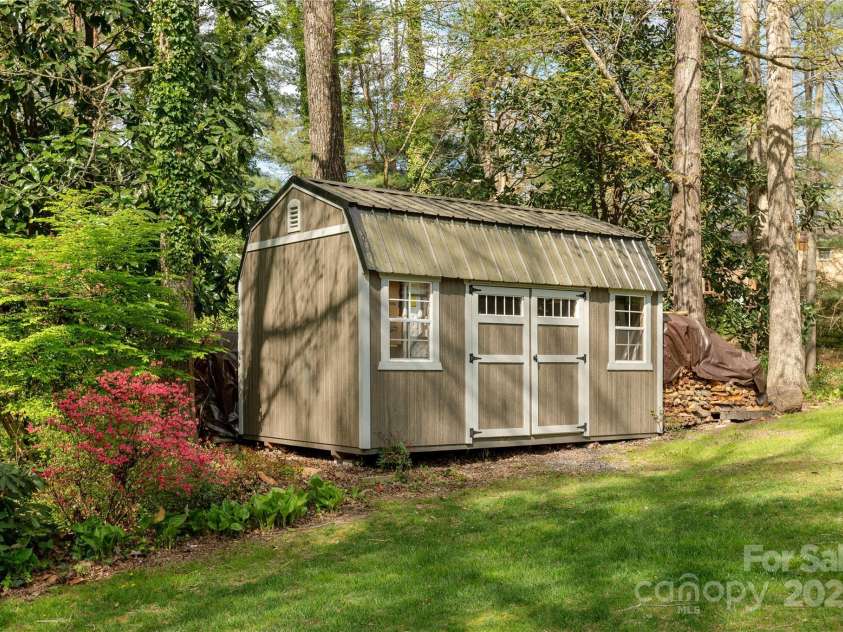 215 Shannon Road, Hendersonville, NC 28791.  MLS# CAR4246696, YatesRealty ID 20077. Shed Conveys