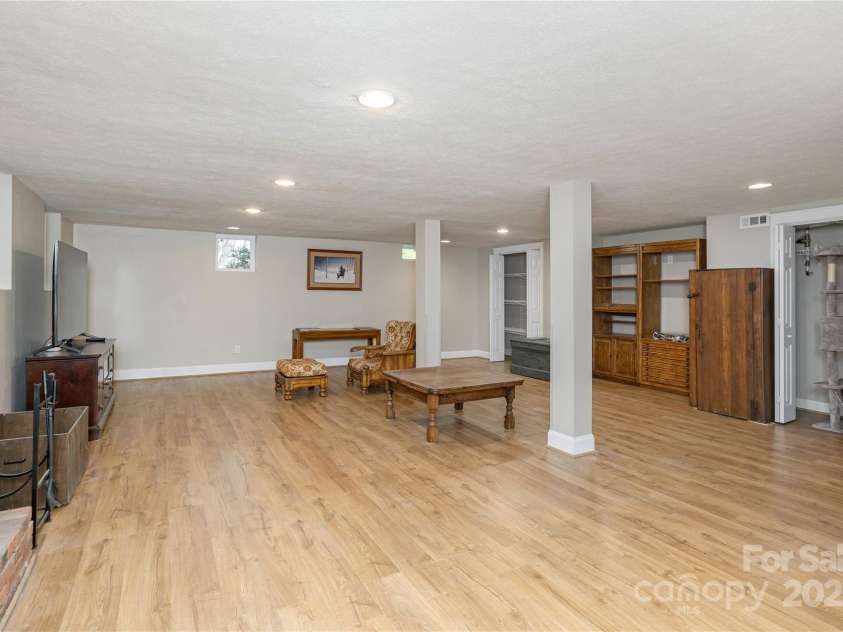 215 Shannon Road, Hendersonville, NC 28791.  MLS# CAR4246696, YatesRealty ID 20077. Spacious Rec Room in Basement