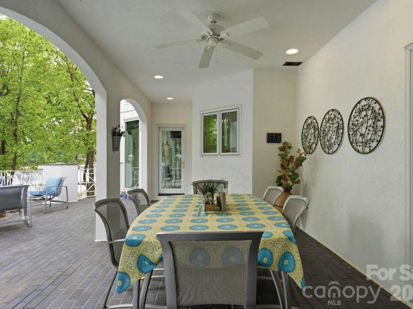 18426 Peninsula Cove Lane, Cornelius, NC 28031.  MLS# CAR4375387, YatesRealty ID 20078. Covered dining area on the terrace