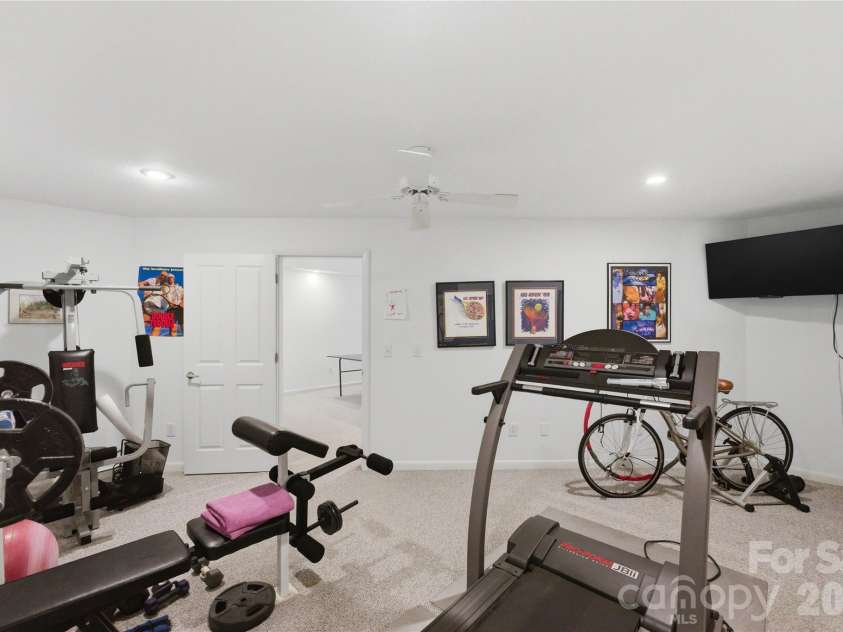18426 Peninsula Cove Lane, Cornelius, NC 28031.  MLS# CAR4375387, YatesRealty ID 20078. Exercise room on lower level