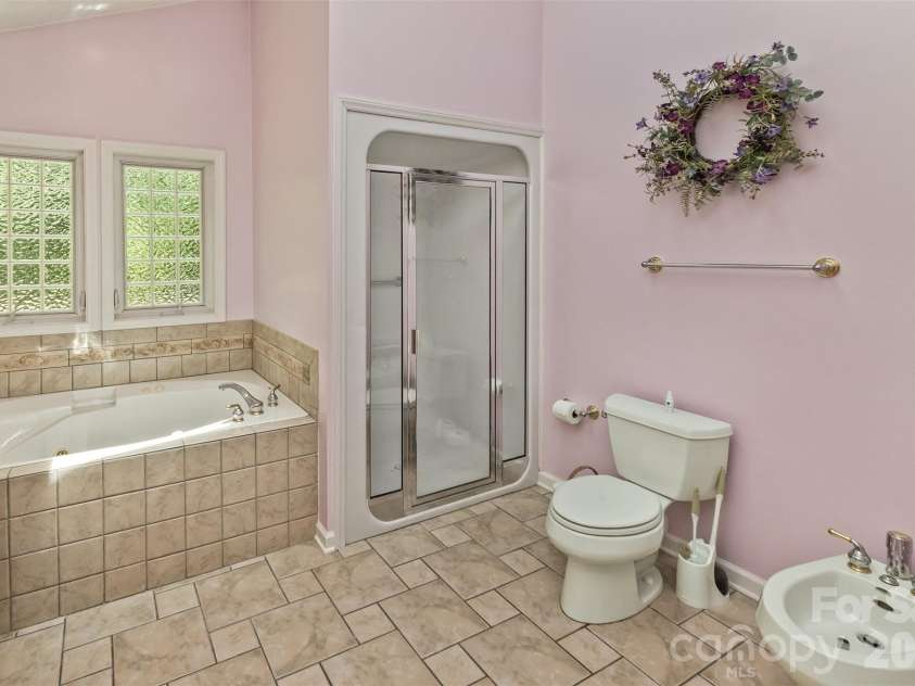55 Stonebridge Drive, Asheville, NC 28805.  MLS# CAR4379940, YatesRealty ID 20084. An updated walk-in shower.