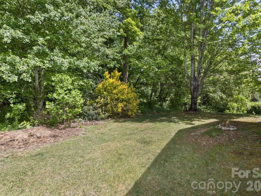 55 Stonebridge Drive, Asheville, NC 28805.  MLS# CAR4379940, YatesRealty ID 20084. Big enough for privacy, small enough for easy maintenance.