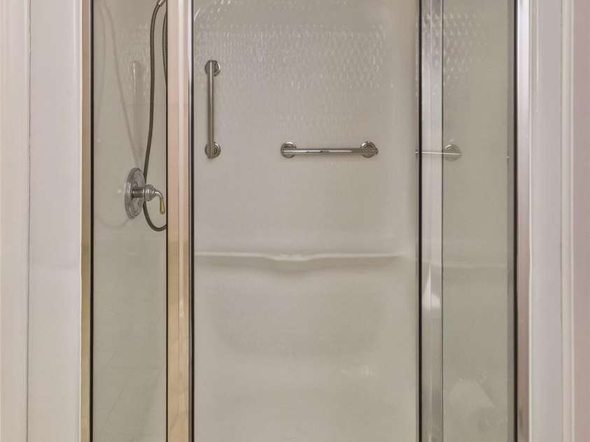 55 Stonebridge Drive, Asheville, NC 28805.  MLS# CAR4379940, YatesRealty ID 20084. Walk-in shower.