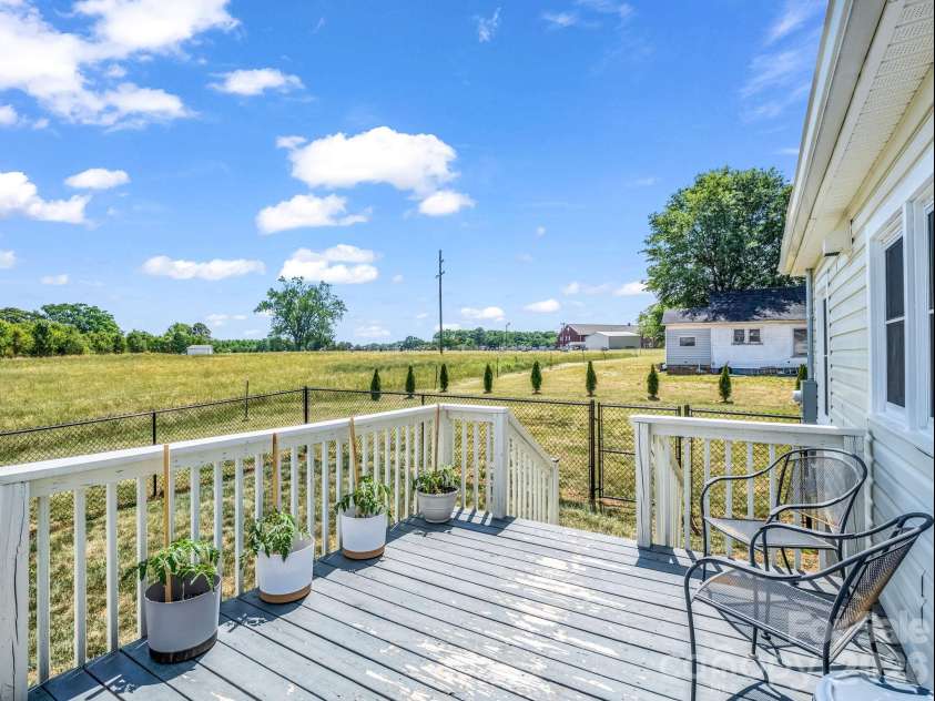 156 Dobbinsville Extension, Ellenboro, NC 28040.  MLS# CAR4379595, YatesRealty ID 20088. Back deck