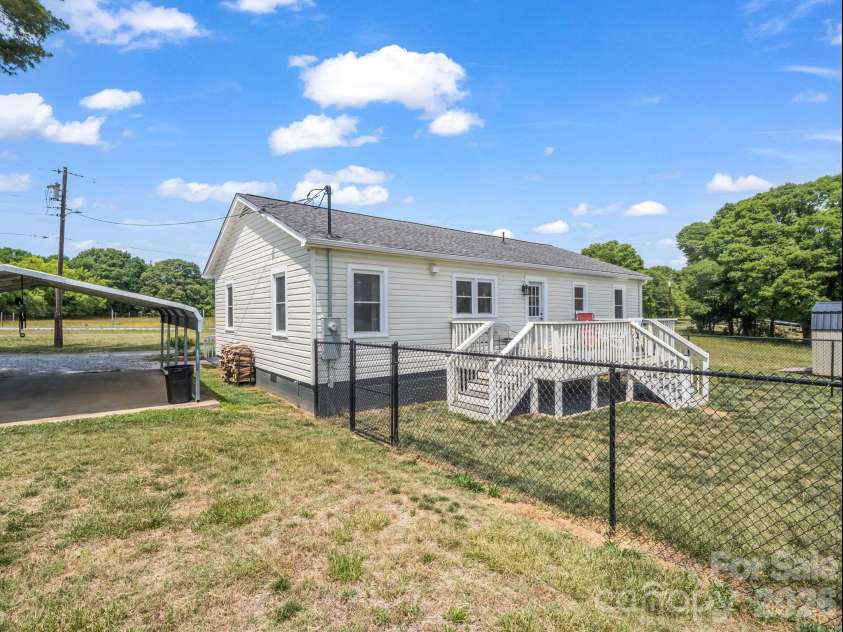 156 Dobbinsville Extension, Ellenboro, NC 28040.  MLS# CAR4379595, YatesRealty ID 20088. Backyard/ back deck
