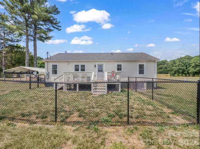 156 Dobbinsville Extension, Ellenboro, NC 28040.  MLS# CAR4379595, YatesRealty ID 20088. Backyard view