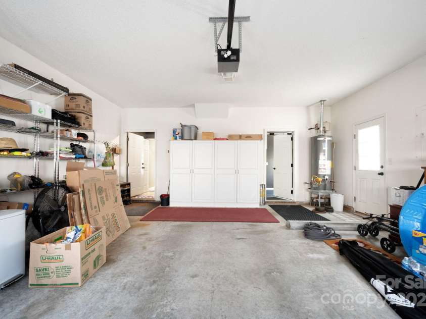207 Farm Creek Drive, Asheville, NC 28806.  MLS# CAR4320360, YatesRealty ID 20088. Big garage with built in shelving. And a secret...