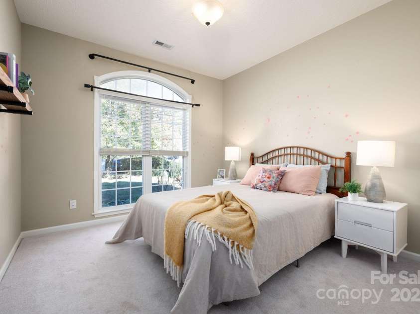 207 Farm Creek Drive, Asheville, NC 28806.  MLS# CAR4320360, YatesRealty ID 20088. Front bedroom with large windows.