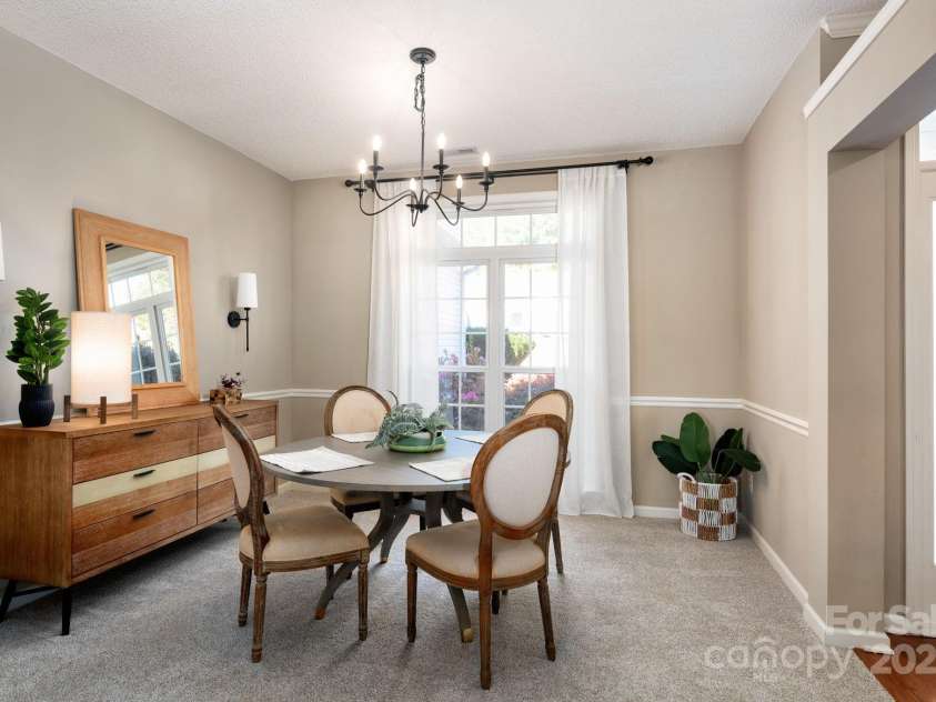 207 Farm Creek Drive, Asheville, NC 28806.  MLS# CAR4320360, YatesRealty ID 20088. Heading to the other side of the house to the guest bedrooms...passing the dining area...