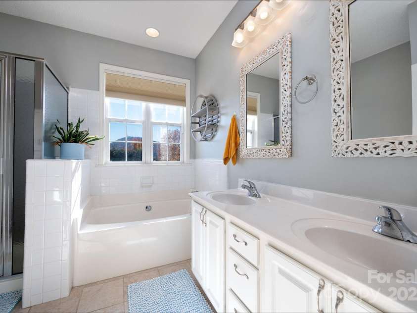 207 Farm Creek Drive, Asheville, NC 28806.  MLS# CAR4320360, YatesRealty ID 20088. Large en suite bathroom with separate tub and shower. And, a view.