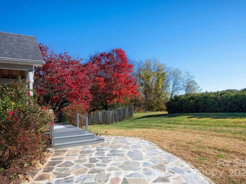 207 Farm Creek Drive, Asheville, NC 28806.  MLS# CAR4320360, YatesRealty ID 20088. Ok, back to the views. Awesome covered porch and stone patio. 