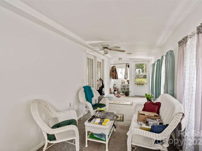 5909 Lake Valley Road, Clover, SC 29710.  MLS# CAR4288971, YatesRealty ID 2009. Covered/ enclosed PORCH off living room