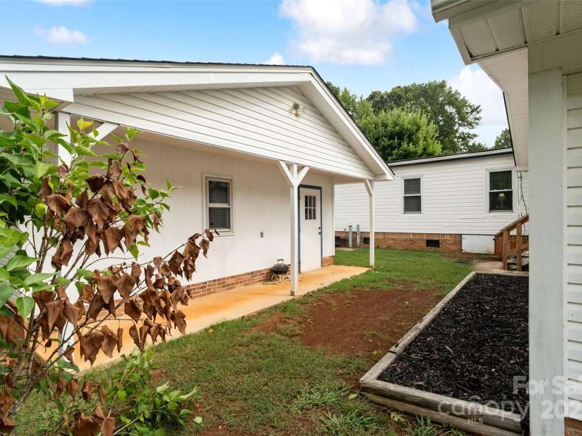 5909 Lake Valley Road, Clover, SC 29710.  MLS# CAR4288971, YatesRealty ID 2009. STORAGE BUILDING behind the detached carport... lets go inside with the next pictures...