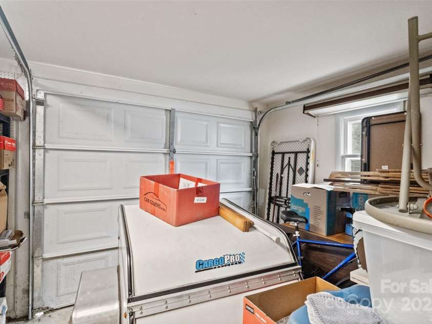 5909 Lake Valley Road, Clover, SC 29710.  MLS# CAR4288971, YatesRealty ID 2009. Storage buildings attached garage area