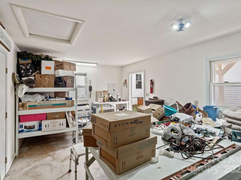 5909 Lake Valley Road, Clover, SC 29710.  MLS# CAR4288971, YatesRealty ID 2009. This area could be converted to HLA with wall & door that goes into the garage area of this storage building separated by wall