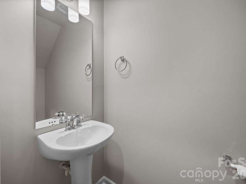 8105 Alderton Lane, Charlotte, NC 28215.  MLS# CAR4307663, YatesRealty ID 20098. Half bathroom