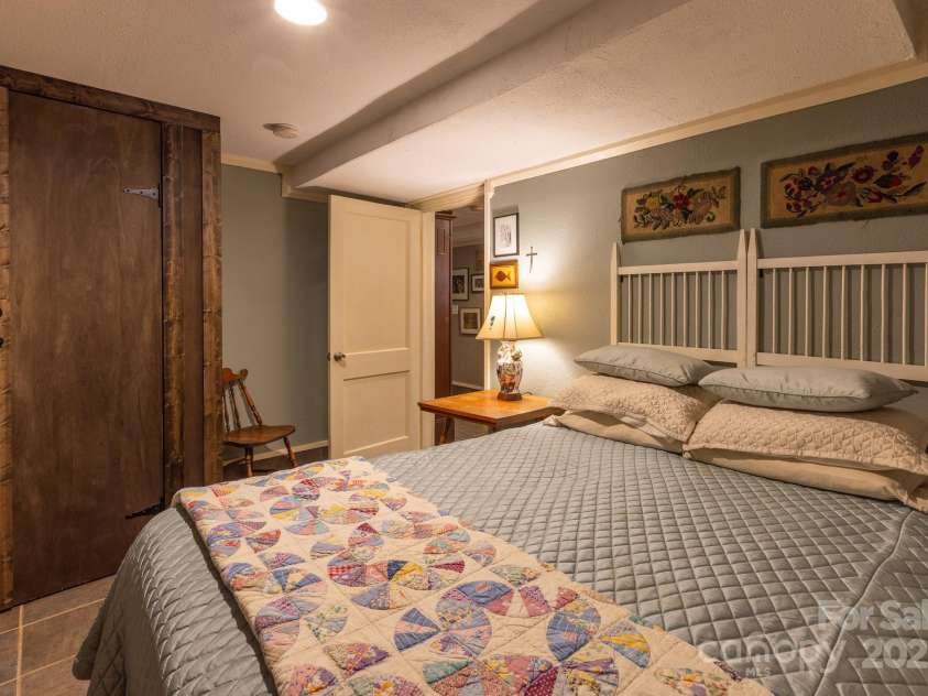 26 Kitazuma Road, Black Mountain, NC 28711.  MLS# CAR4199228, YatesRealty ID 20115. Bedroom one on Main. 2nd bedroom on main being used for storage, no picture.