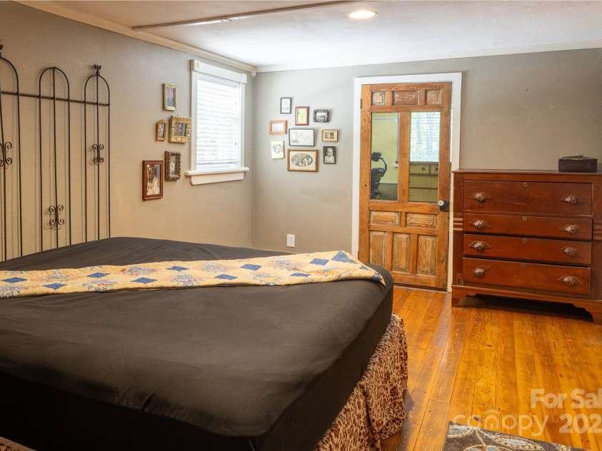 26 Kitazuma Road, Black Mountain, NC 28711.  MLS# CAR4199228, YatesRealty ID 20115. Cute Wak-In Closet Screen Door Matches the Historic Nature of the Home!