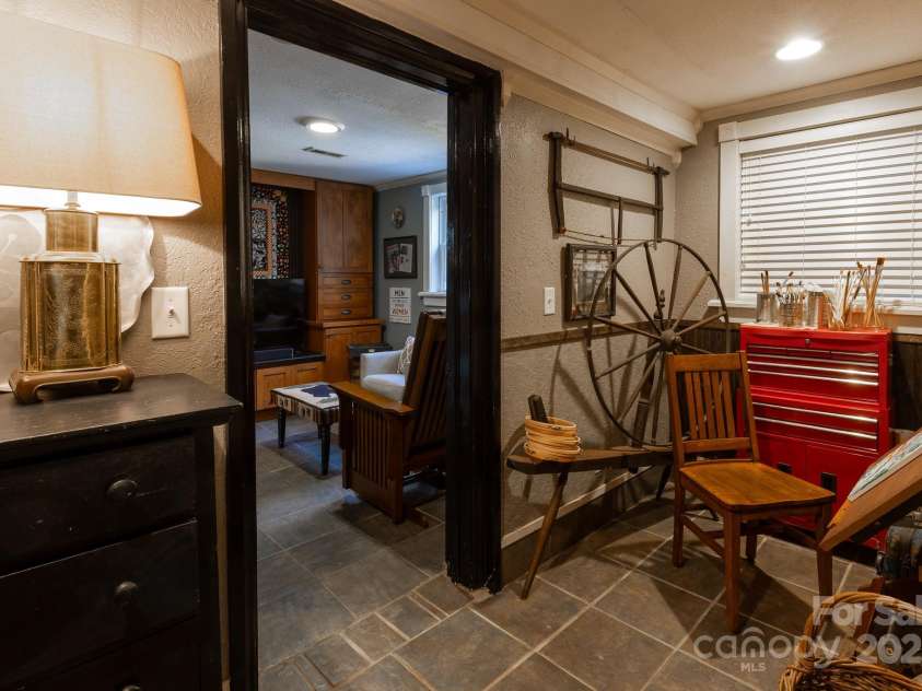26 Kitazuma Road, Black Mountain, NC 28711.  MLS# CAR4199228, YatesRealty ID 20115. Downstairs Hallway Nook.