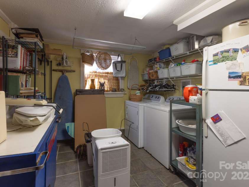 26 Kitazuma Road, Black Mountain, NC 28711.  MLS# CAR4199228, YatesRealty ID 20115. Large pantry/laundry combo.