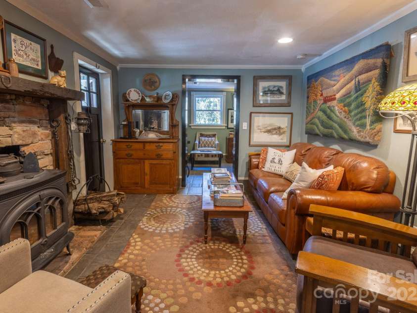 26 Kitazuma Road, Black Mountain, NC 28711.  MLS# CAR4199228, YatesRealty ID 20115. Living Room with door(s) to sunporch.