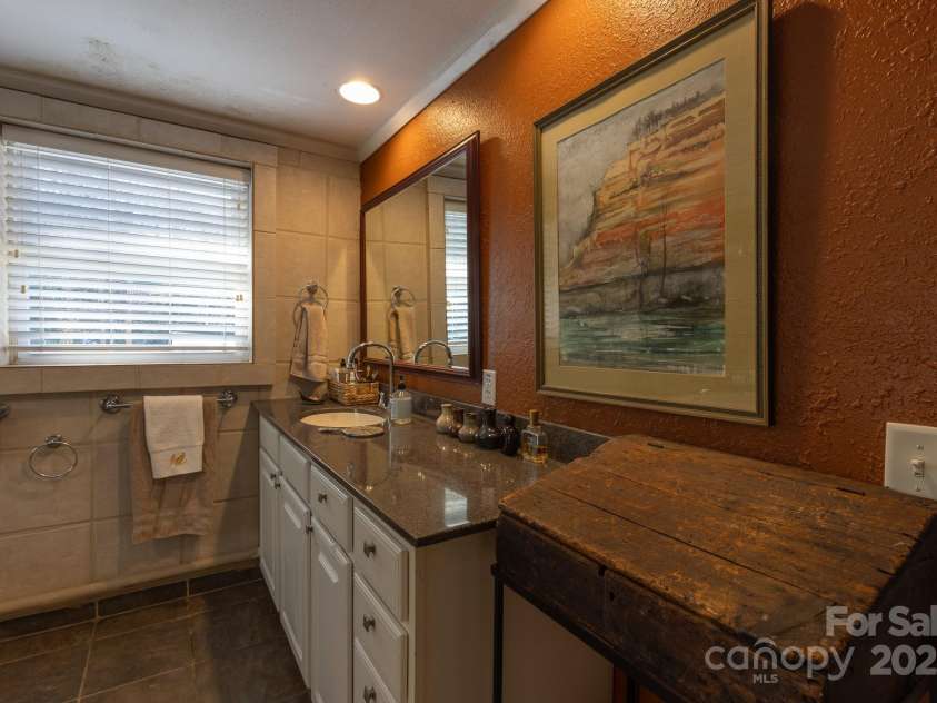 26 Kitazuma Road, Black Mountain, NC 28711.  MLS# CAR4199228, YatesRealty ID 20115. Primary upstairs vanity.