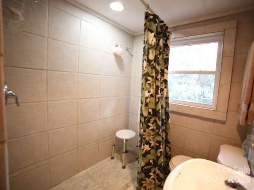 26 Kitazuma Road, Black Mountain, NC 28711.  MLS# CAR4199228, YatesRealty ID 20115. Second Floor Hall Bathroom Features Walk In Shower.