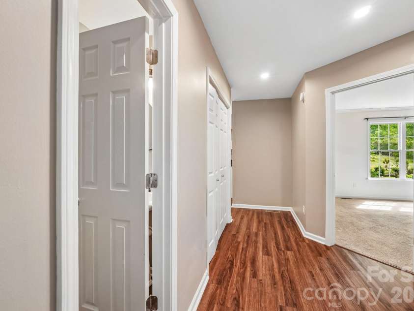 917 Clover Park Drive, Clover, SC 29710.  MLS# CAR4378029, YatesRealty ID 20115. Hall with 1/2 bath, laundry, and primary