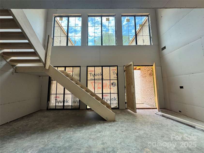 5427 Addison Drive, Charlotte, NC 28211.  MLS# CAR4258446, YatesRealty ID 20122. Dramatic two-story foyer flooded with natural light from soaring windows, creating a bright and sophisticated modern vibe