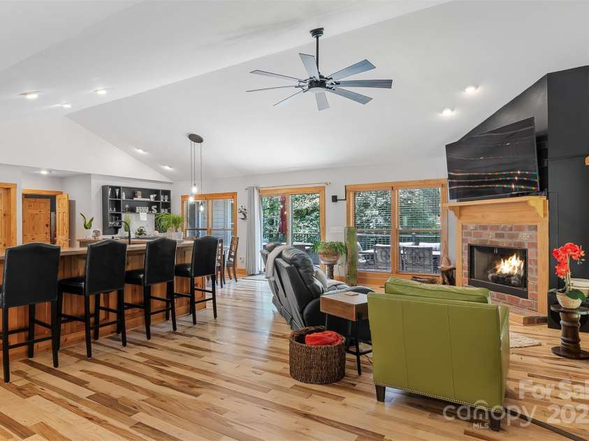 5690 Anchor Drive, Granite Falls, NC 28630.  MLS# CAR4252807, YatesRealty ID 20124. Great room features long breakfast bar, seating area and gas log fireplace.