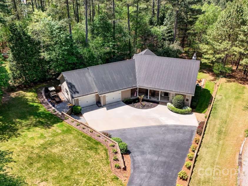 5690 Anchor Drive, Granite Falls, NC 28630.  MLS# CAR4252807, YatesRealty ID 20124. Home features metal roof.
