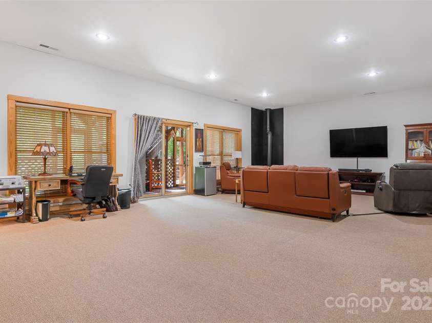 5690 Anchor Drive, Granite Falls, NC 28630.  MLS# CAR4252807, YatesRealty ID 20124. Huge basement features exit to screened patio with hot tub and large wooded back yard.