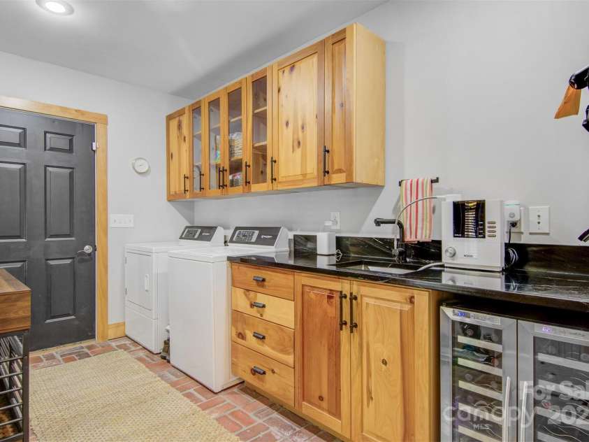 5690 Anchor Drive, Granite Falls, NC 28630.  MLS# CAR4252807, YatesRealty ID 20124. Laundry room has new soapstone counters, beautiful cabinets, door enters into oversized garage.