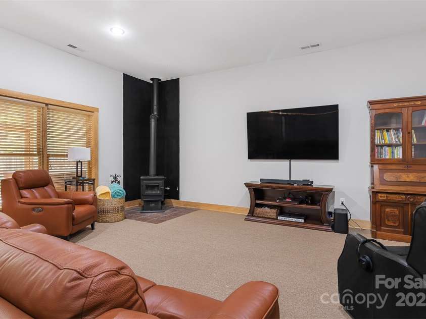 5690 Anchor Drive, Granite Falls, NC 28630.  MLS# CAR4252807, YatesRealty ID 20124. New wood stove will keep you warm on cool winter nights! TV will not remain.