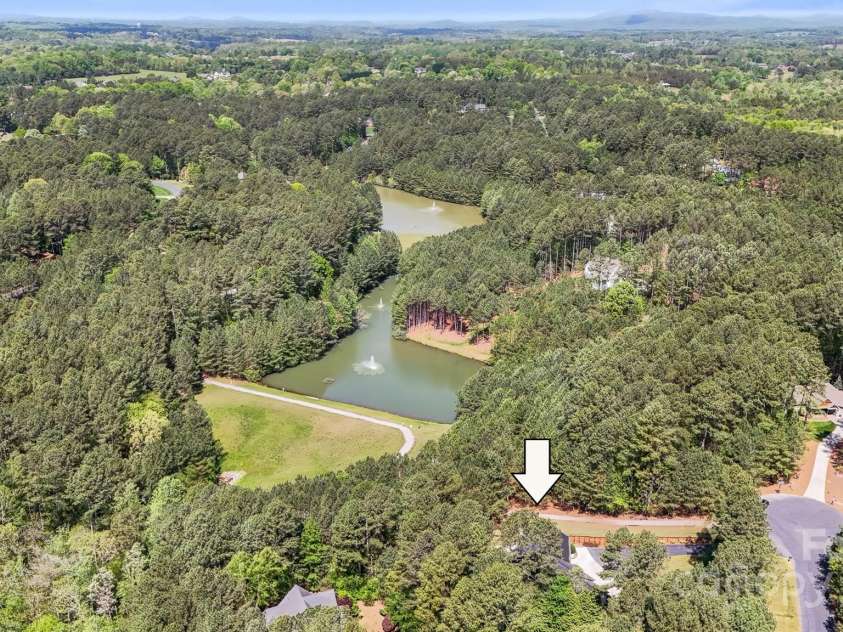 5690 Anchor Drive, Granite Falls, NC 28630.  MLS# CAR4252807, YatesRealty ID 20124. Pond near back of this property.