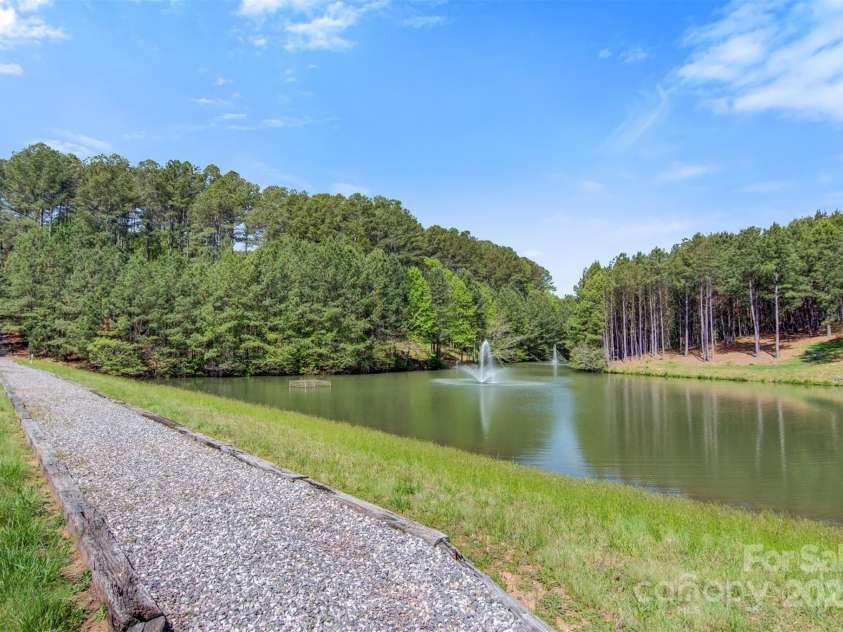 5690 Anchor Drive, Granite Falls, NC 28630.  MLS# CAR4252807, YatesRealty ID 20124. View of pond