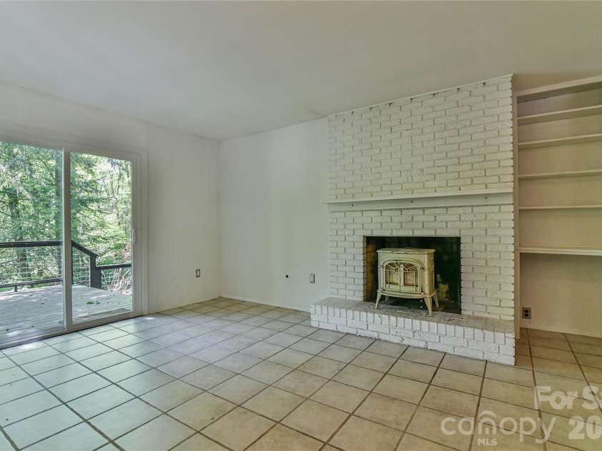 1 Hillcrest Lane, Black Mountain, NC 28711.  MLS# CAR4368421, YatesRealty ID 20131. Dining area opens to upper deck