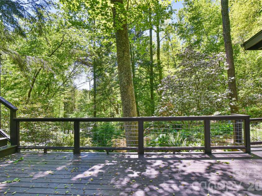 1 Hillcrest Lane, Black Mountain, NC 28711.  MLS# CAR4368421, YatesRealty ID 20131. Living room opens to this deck